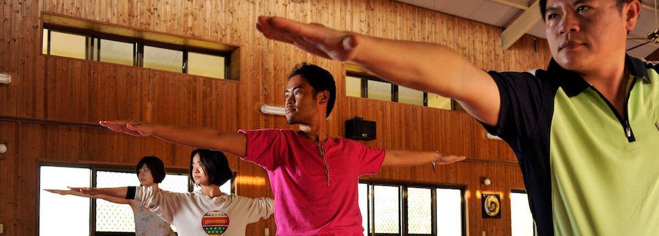 Group practicing yoga postures indoors